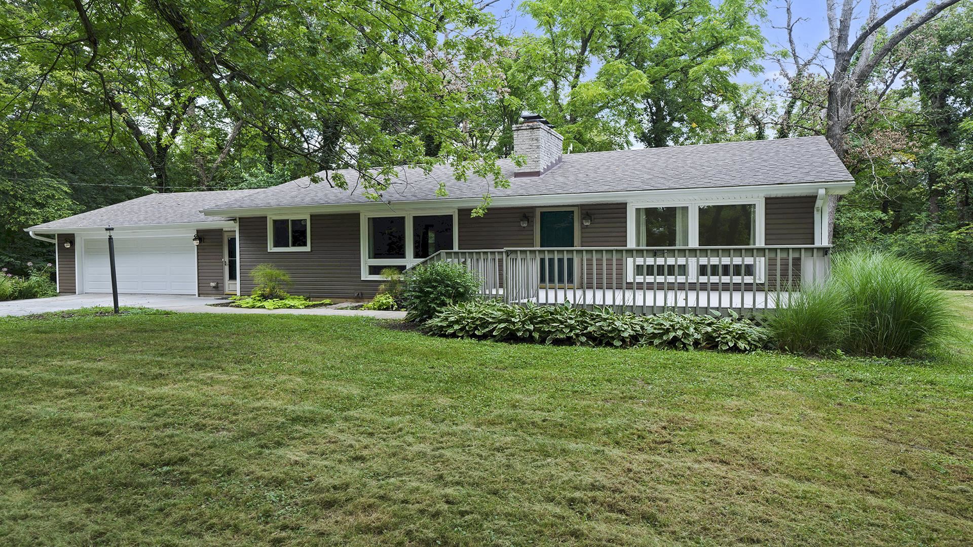 3691 South Bend Road Rockford, IL 61109 - Photo 32 of 34 a front view of a house with a garden
