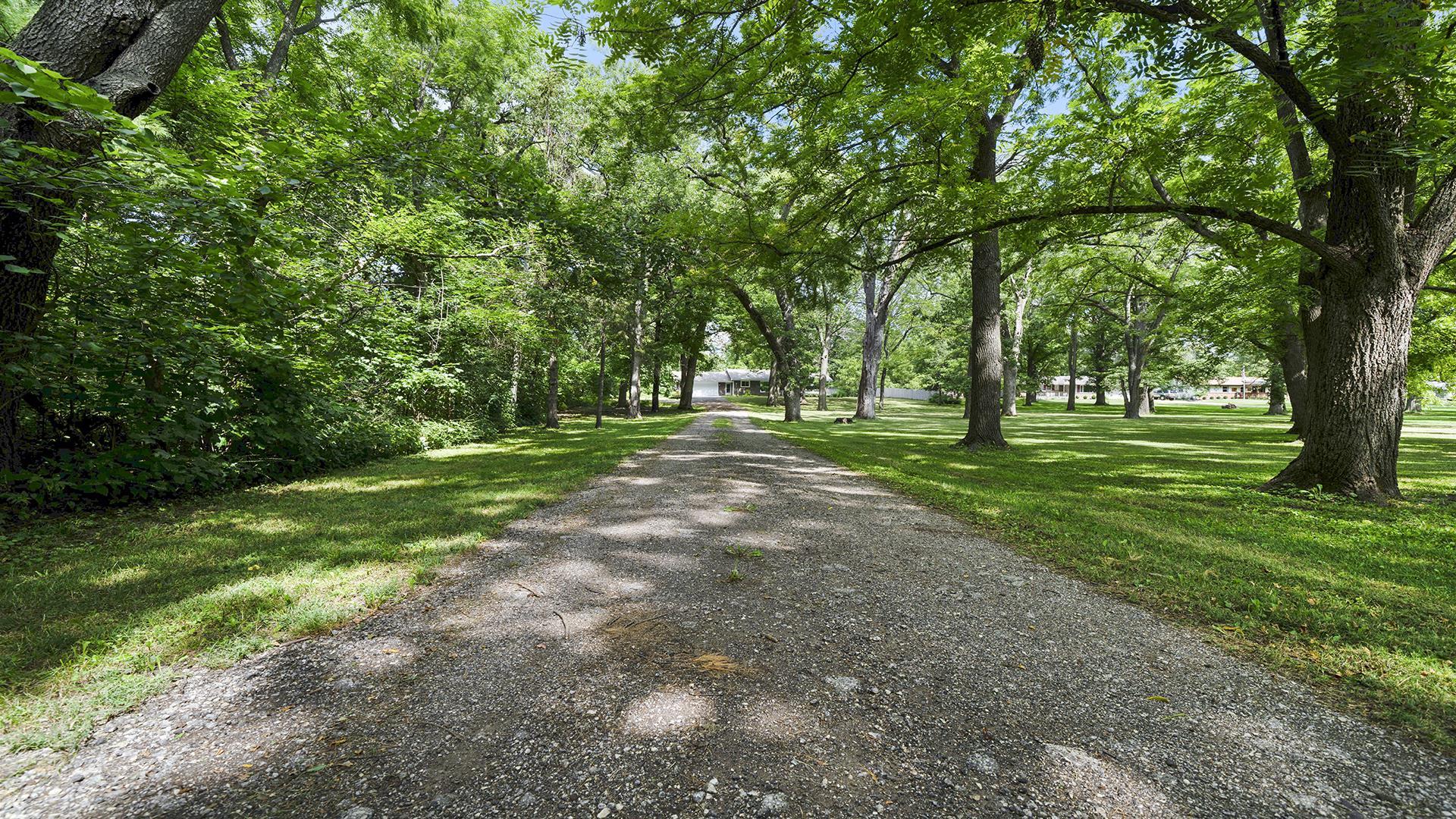 3691 South Bend Road Rockford, IL 61109 - Photo 33 of 34 a view of a park with large trees