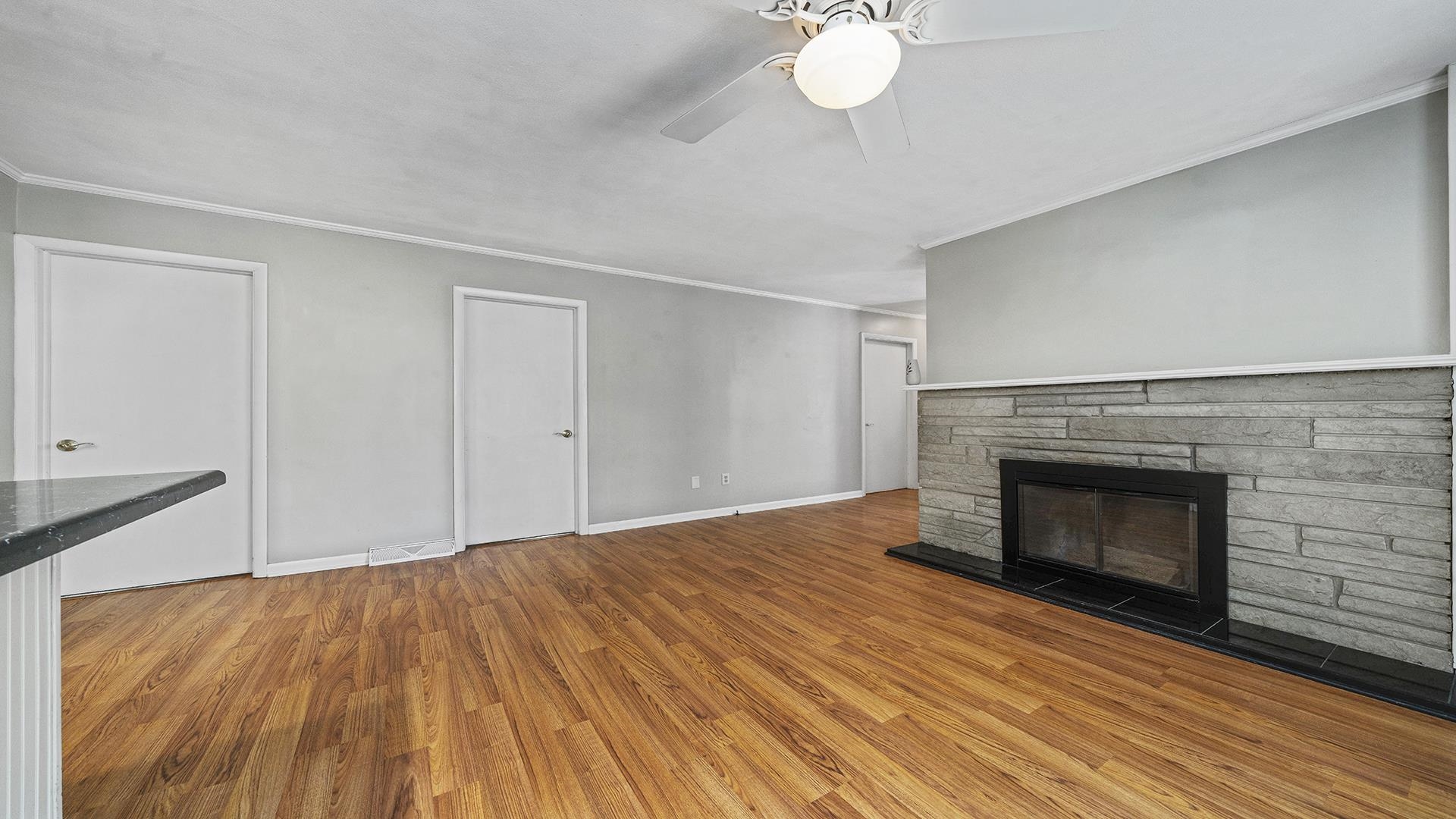 3691 South Bend Road Rockford, IL 61109 - Photo 10 of 34 a view of empty room with wooden floor and fireplace