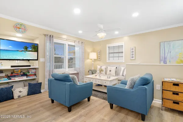 a living room with furniture and a flat screen tv