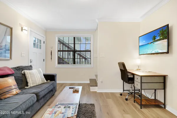a living room with furniture and a window