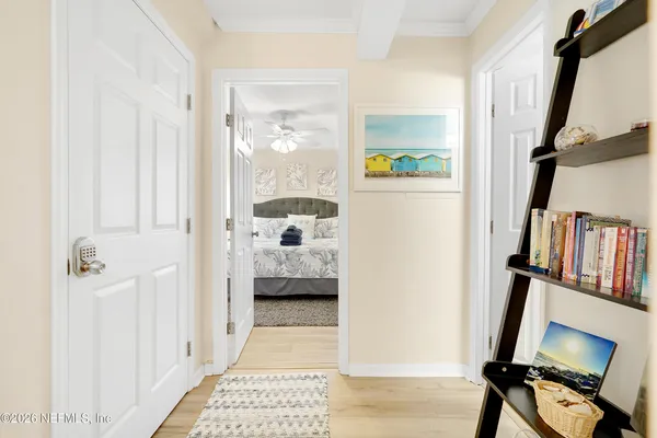 a bedroom with a bed and a book shelf
