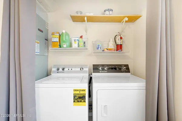 a utility room with dryer and washer