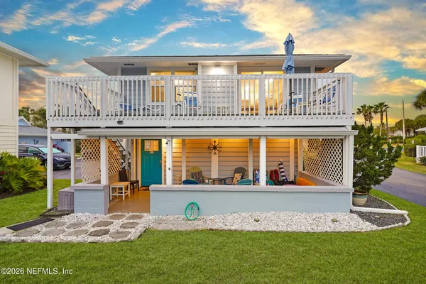 a front view of building with an garden and entertaining space