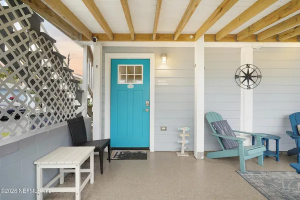 a view of a hallway with chairs and a large window