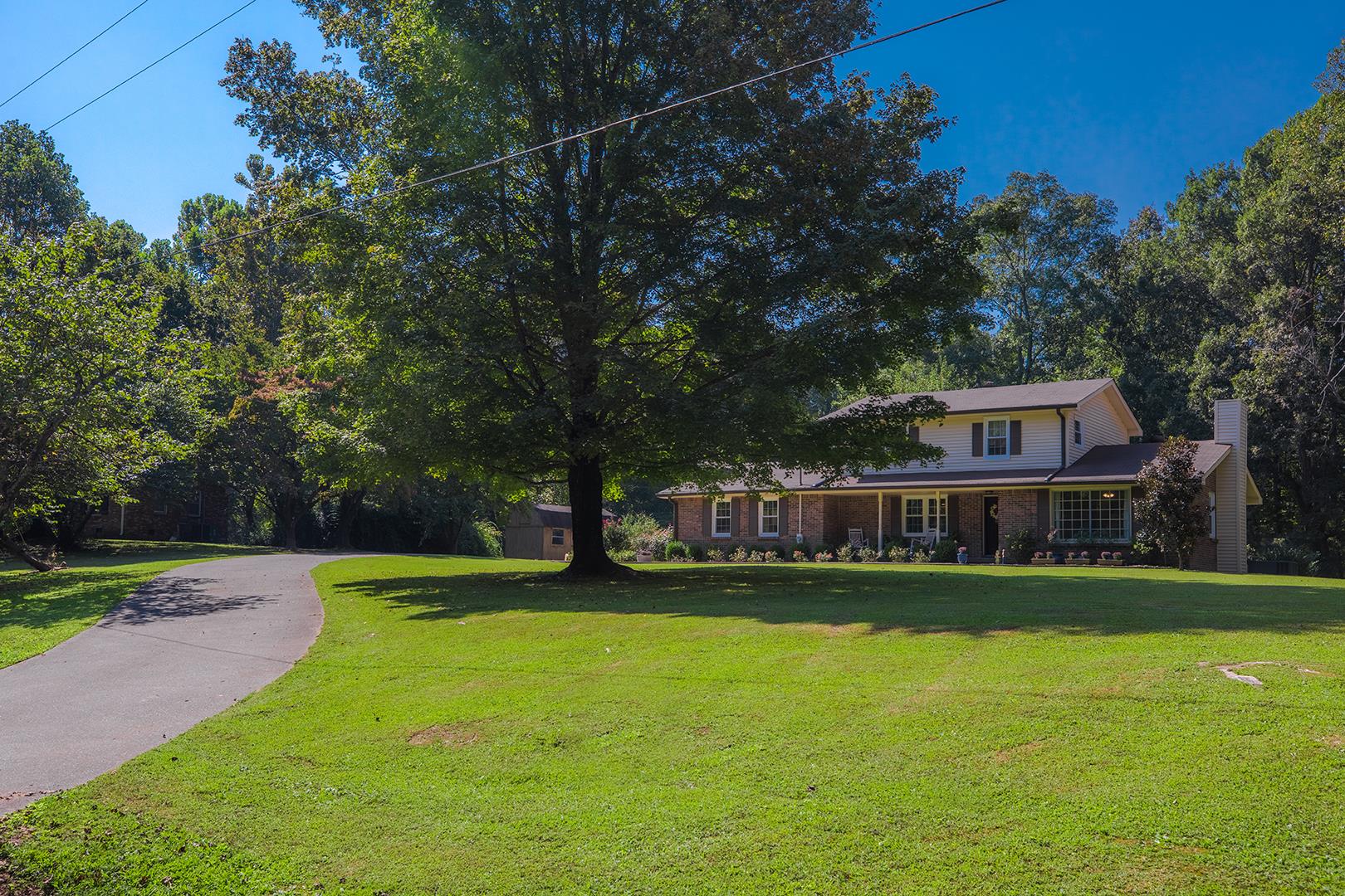 7574 King Road Fairview, TN 37062 - Photo 1 of 30 a view of a swimming pool with a yard and trees