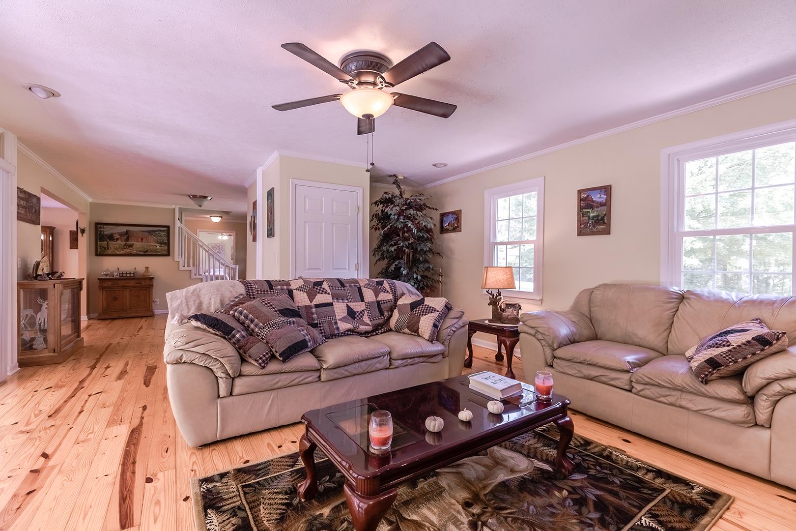 7574 King Road Fairview, TN 37062 - Photo 18 of 30 a living room with furniture a chandelier and a window