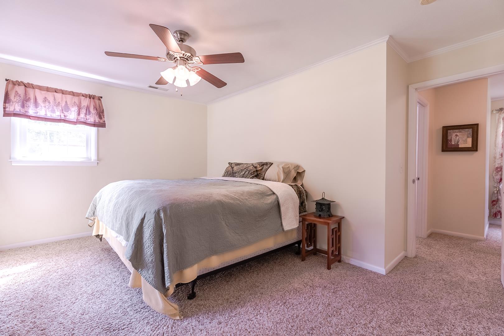 7574 King Road Fairview, TN 37062 - Photo 24 of 30 a bedroom with a bed and a ceiling fan