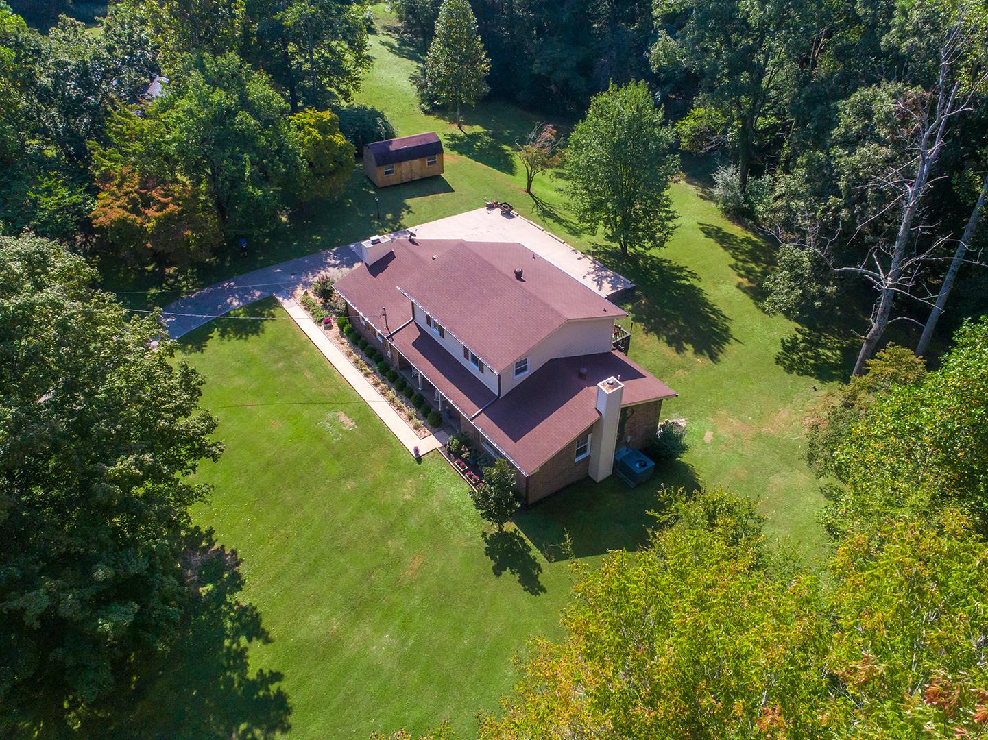 7574 King Road Fairview, TN 37062 - Photo 28 of 30 an aerial view of a house with a garden and swimming pool