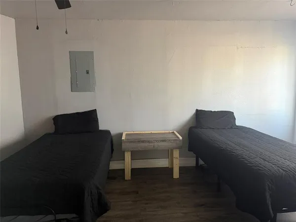 a living room with furniture and a chair