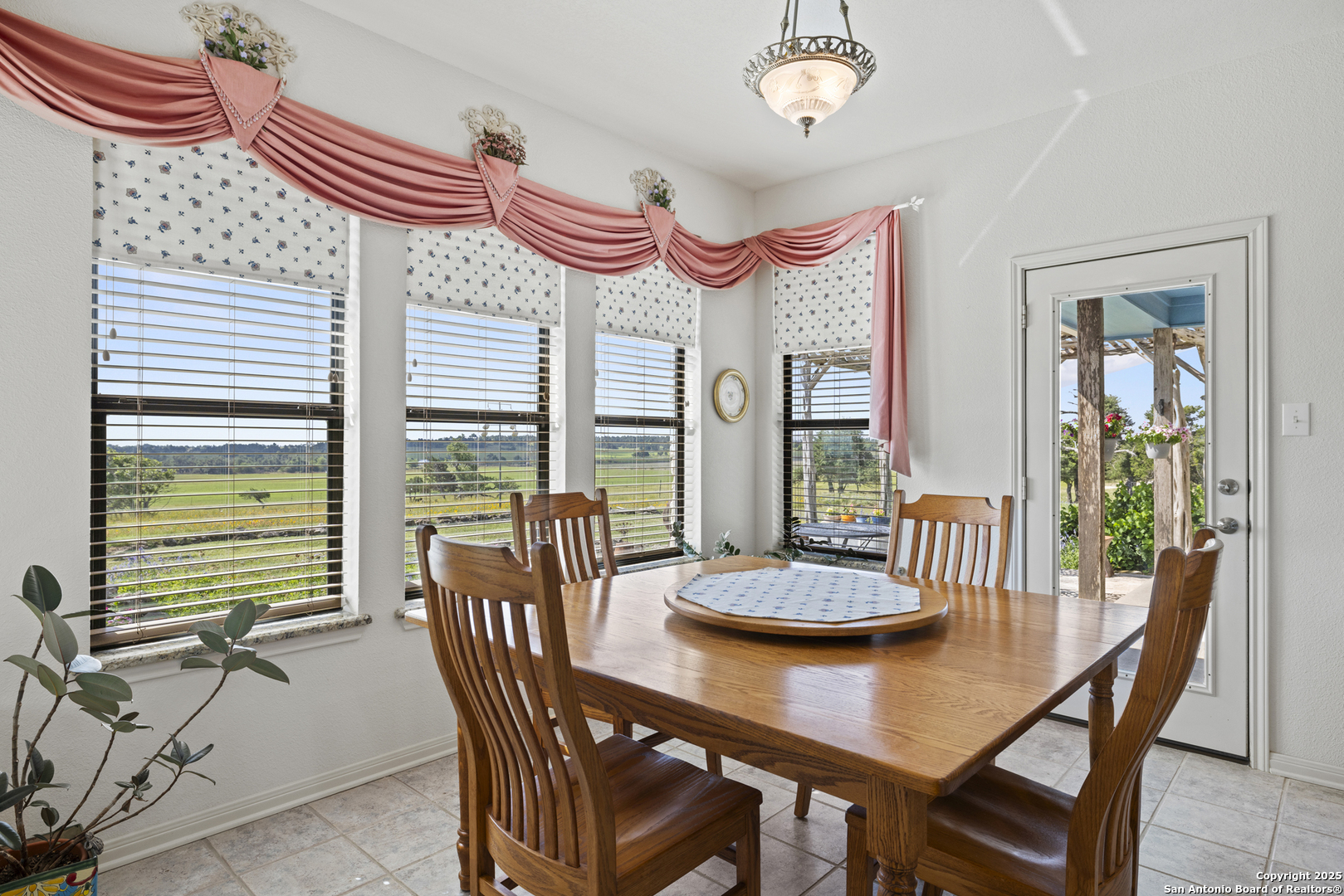 564 Gypsum Mine Road Fredericksburg, TX 78624 - Photo 5 of 20 a view of a dining room with furniture window and outside view