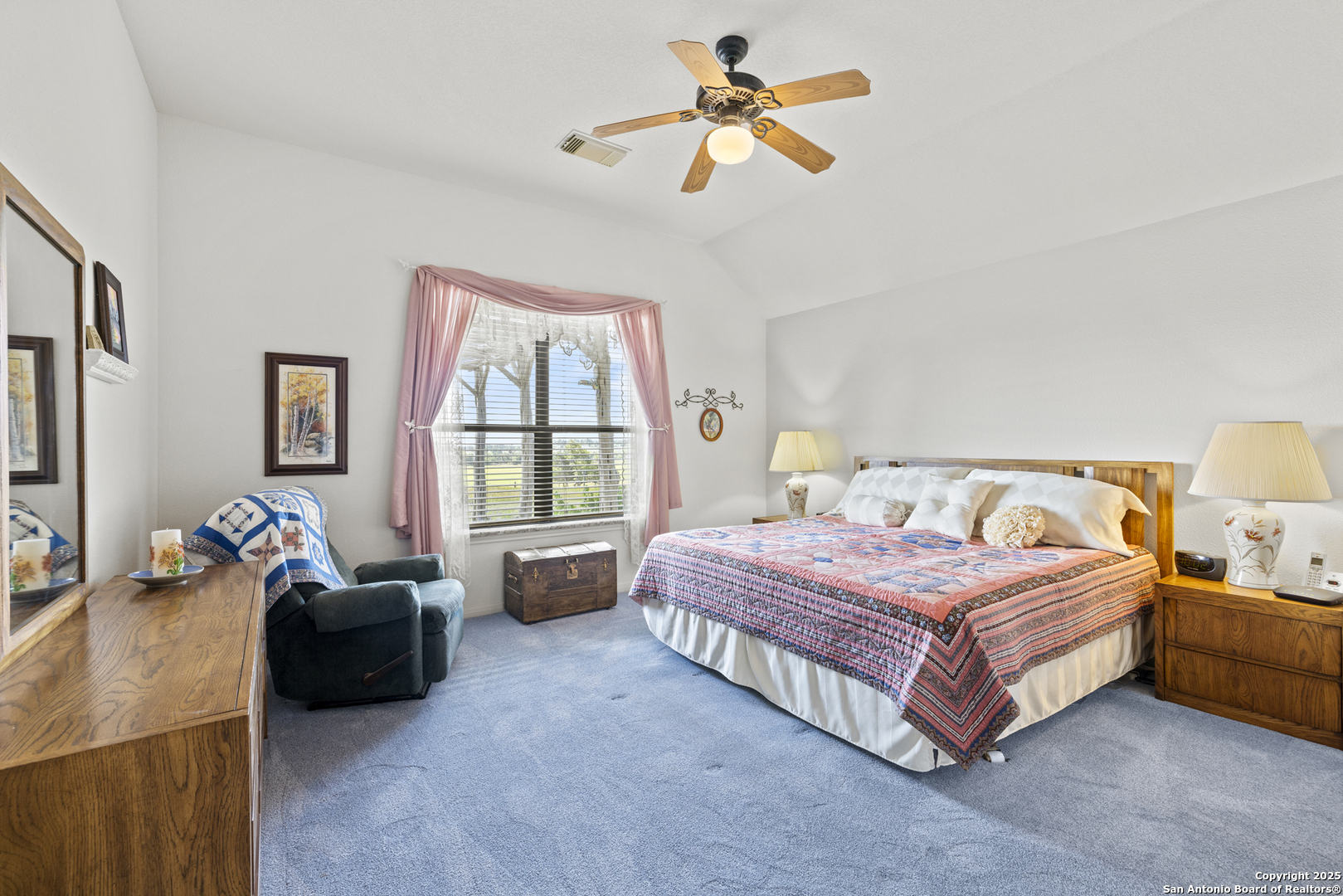 564 Gypsum Mine Road Fredericksburg, TX 78624 - Photo 6 of 20 a spacious bedroom with a bed and a couch