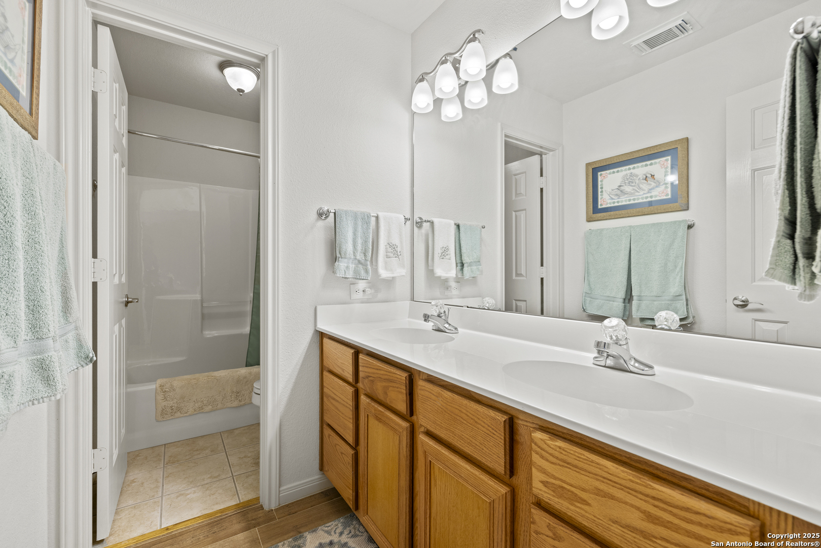 564 Gypsum Mine Road Fredericksburg, TX 78624 - Photo 10 of 20 a bathroom with double vanity sinks and a shower