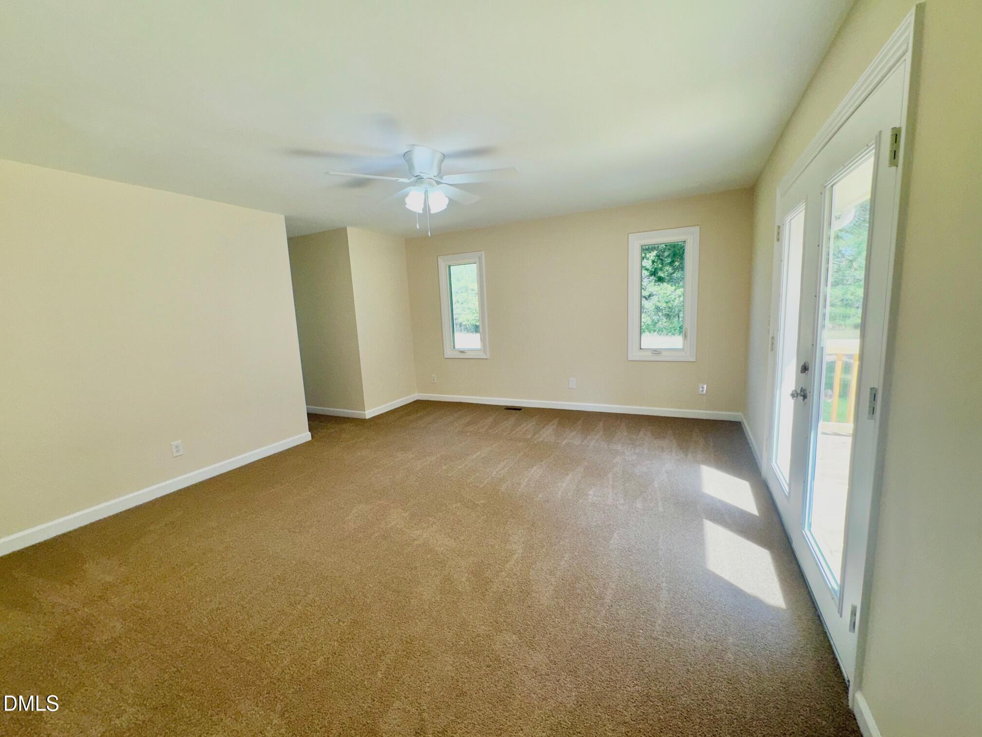 1720 Ross Mill Road Henderson, NC 27537 - Photo 20 of 42 an empty room with a empty space and windows