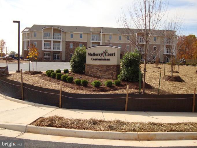 1801 Berry Ridge Drive, Unit 240 Culpeper, VA 22701 - Photo 1 of 16 a view of a building and car parked