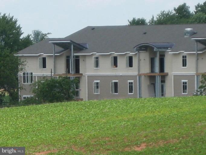 1801 Berry Ridge Drive, Unit 240 Culpeper, VA 22701 - Photo 11 of 16 a aerial view of a house next to a big yard