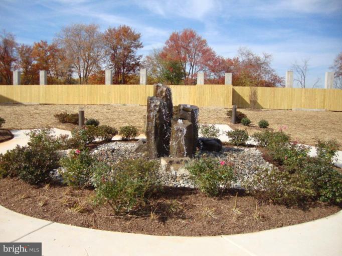 1801 Berry Ridge Drive, Unit 240 Culpeper, VA 22701 - Photo 13 of 16 a view of a lake with houses in the back