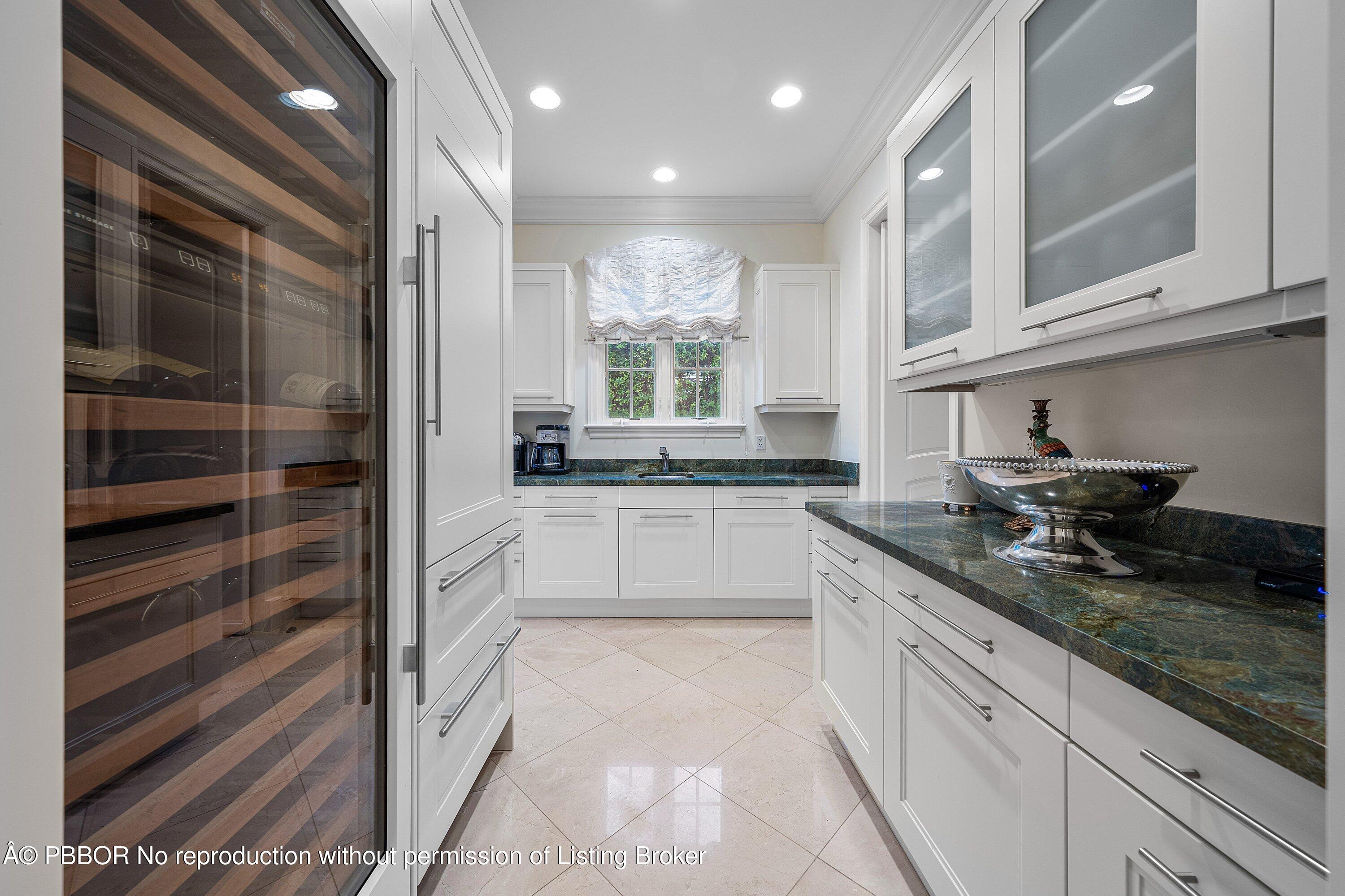 242 Wells Road Palm Beach, FL 33480 - Photo 14 of 54 a large kitchen with granite countertop a sink and a stove