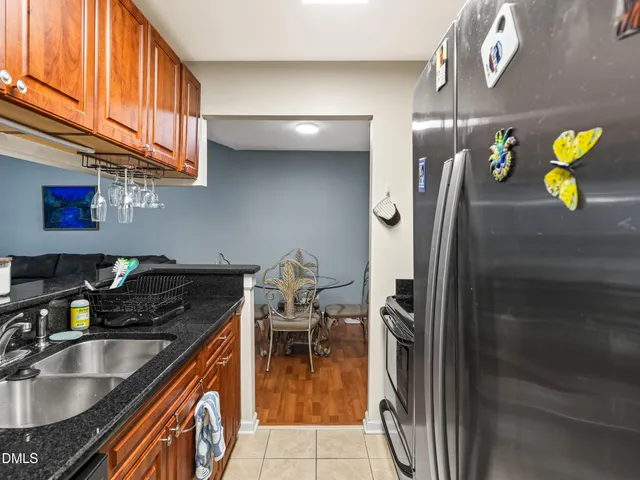 a kitchen with stainless steel appliances granite countertop a stove and a microwave
