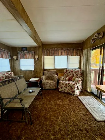 a bedroom with furniture and a wooden floor