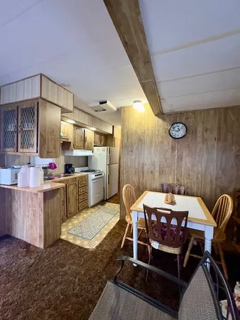 a kitchen with refrigerator and cabinets