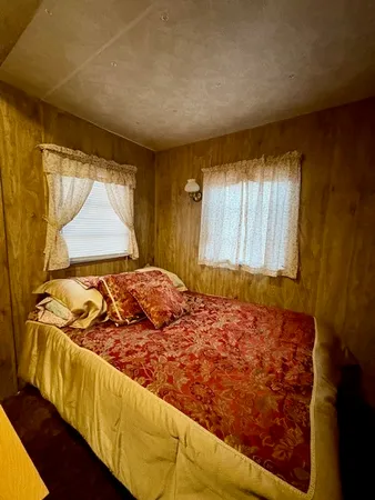 a bedroom with a bed and a dresser