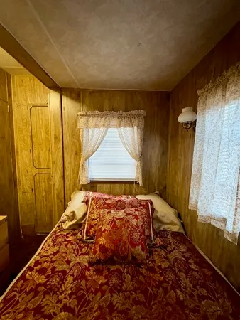 a bedroom with a bed and a table