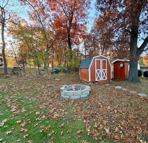 a backyard of a house with lots of green space