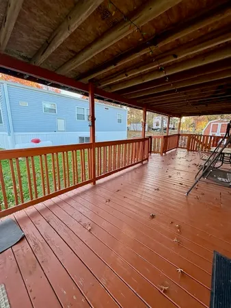 a view of a porch with wooden floor