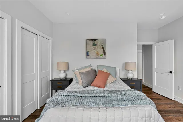 a bedroom with bed and a window