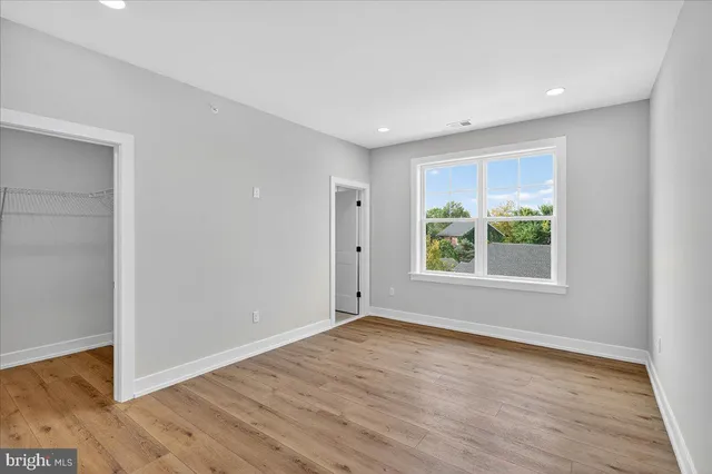 a view of a balcony with wooden floor