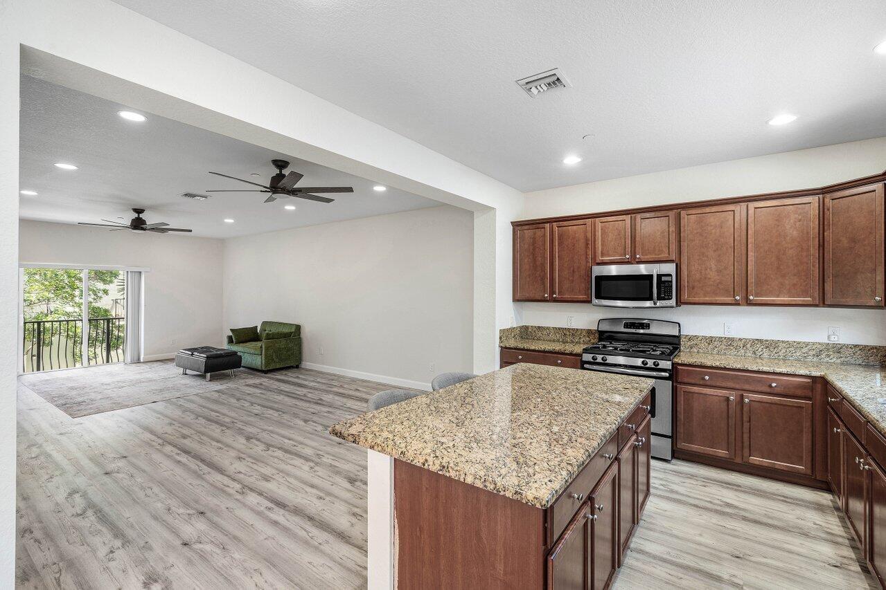 48 Northwest Hawthorne Place Boca Raton, FL 33432 - Photo 18 of 35 Kitchen Overlooking Living Room