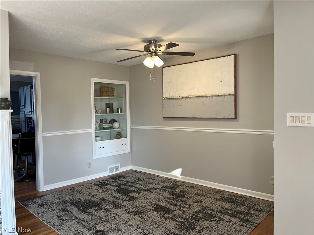 534 Overwood Road Akron, OH 44313 - Photo 9 of 30 Hardwood flooring, built in cabinet, chair rail and ceiling fan