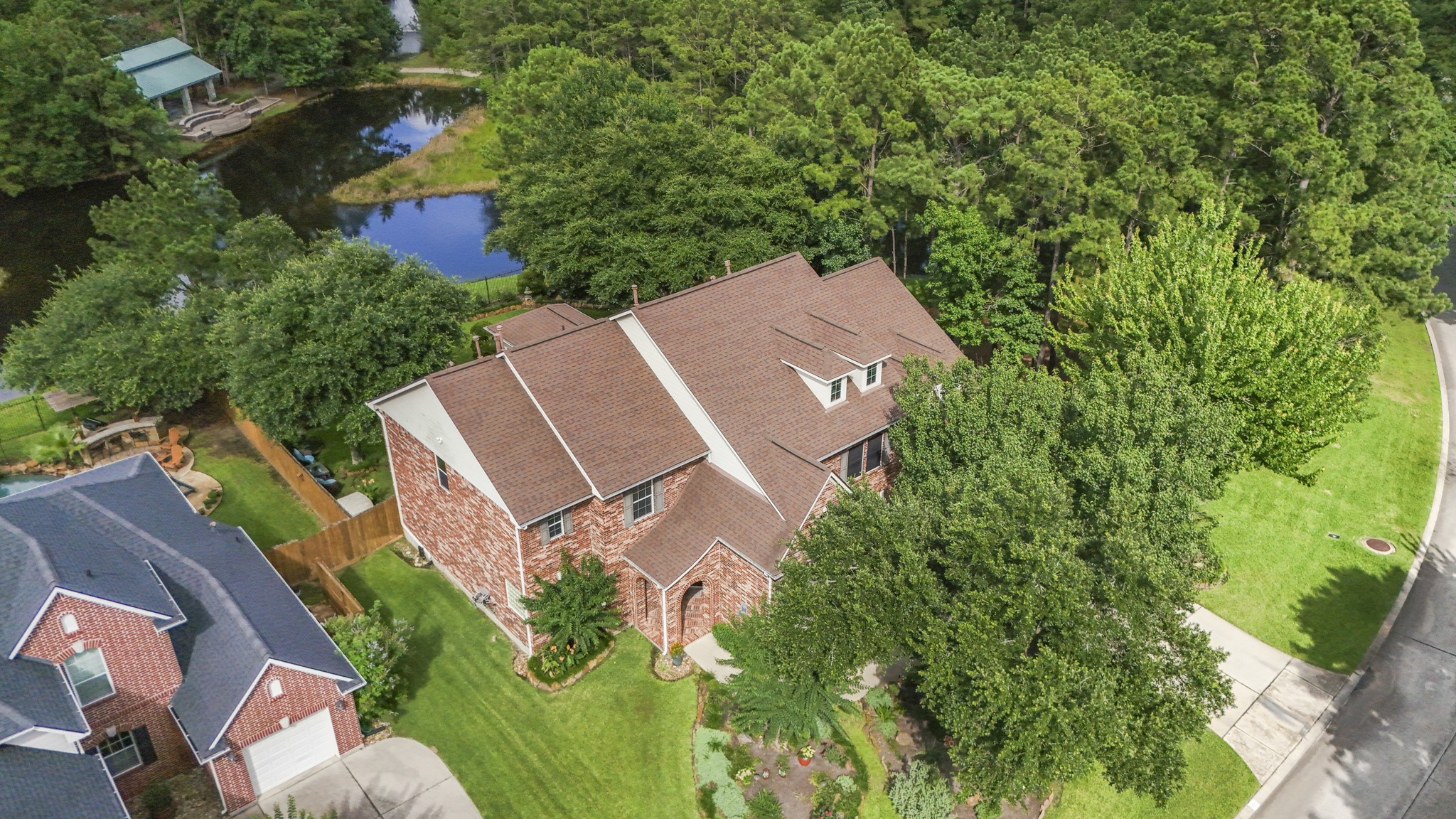 67 North Pentenwell Circle Spring, TX 77382 - Photo 2 of 50 an aerial view of a house with a yard and trees