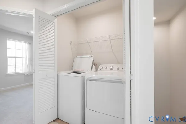 a view of an empty room and a window