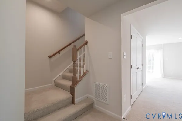 a view of an empty room and a window