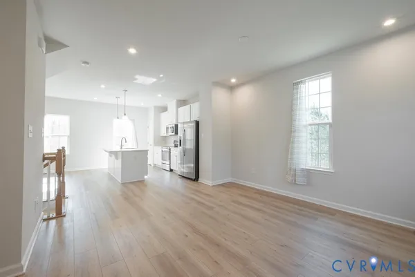 a view of kitchen with wooden floor and window