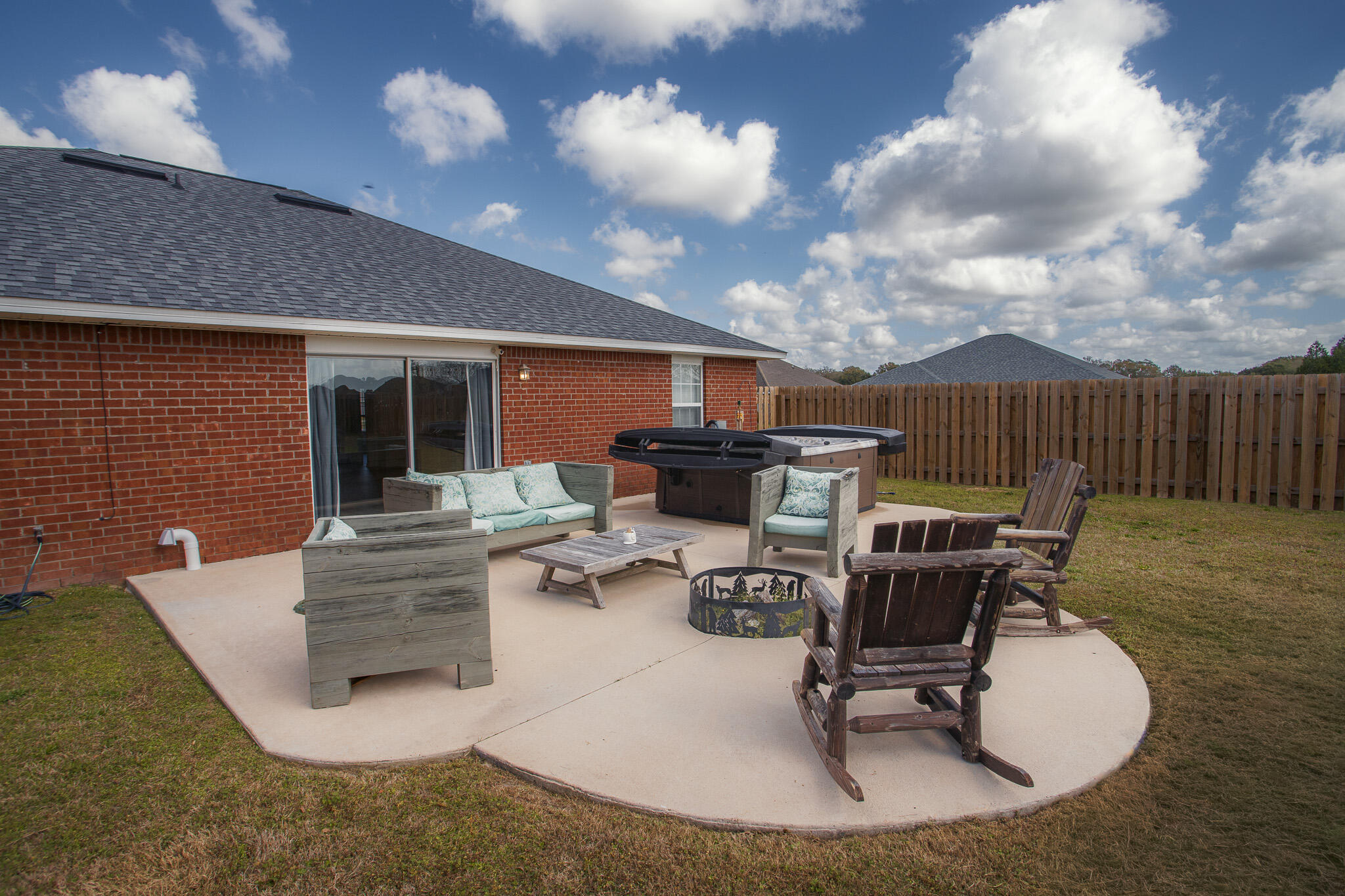 2233 Lewis Street Crestview, FL 32536 - Photo 19 of 24 a view of a patio with table and chairs with wooden floor and fence