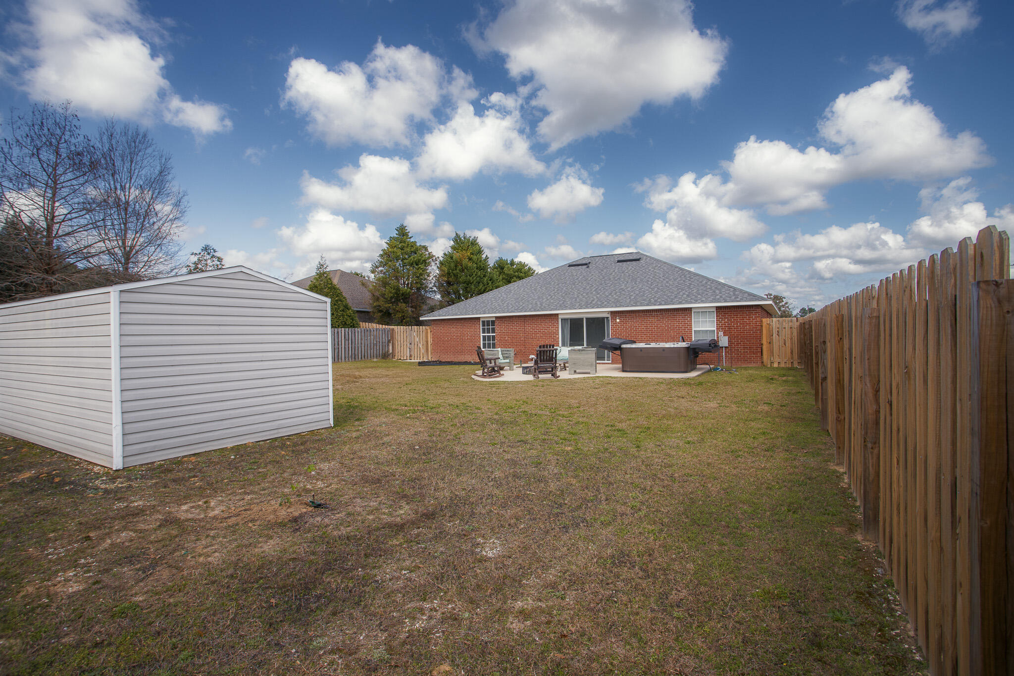 2233 Lewis Street Crestview, FL 32536 - Photo 22 of 24 a front view of a house with a yard