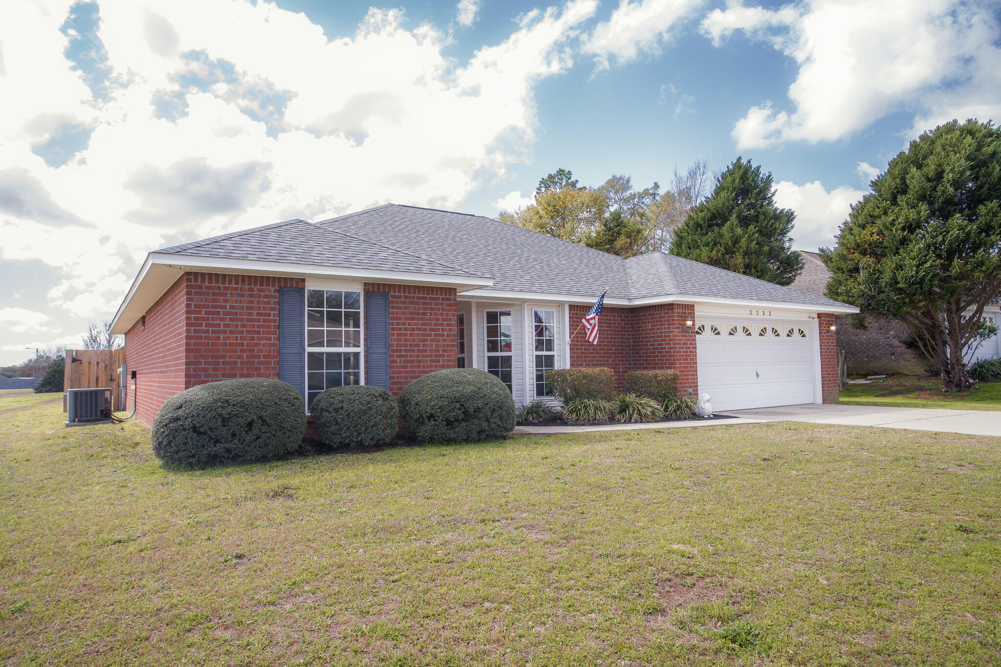2233 Lewis Street Crestview, FL 32536 - Photo 24 of 24 a view of a house with a outdoor space and a yard