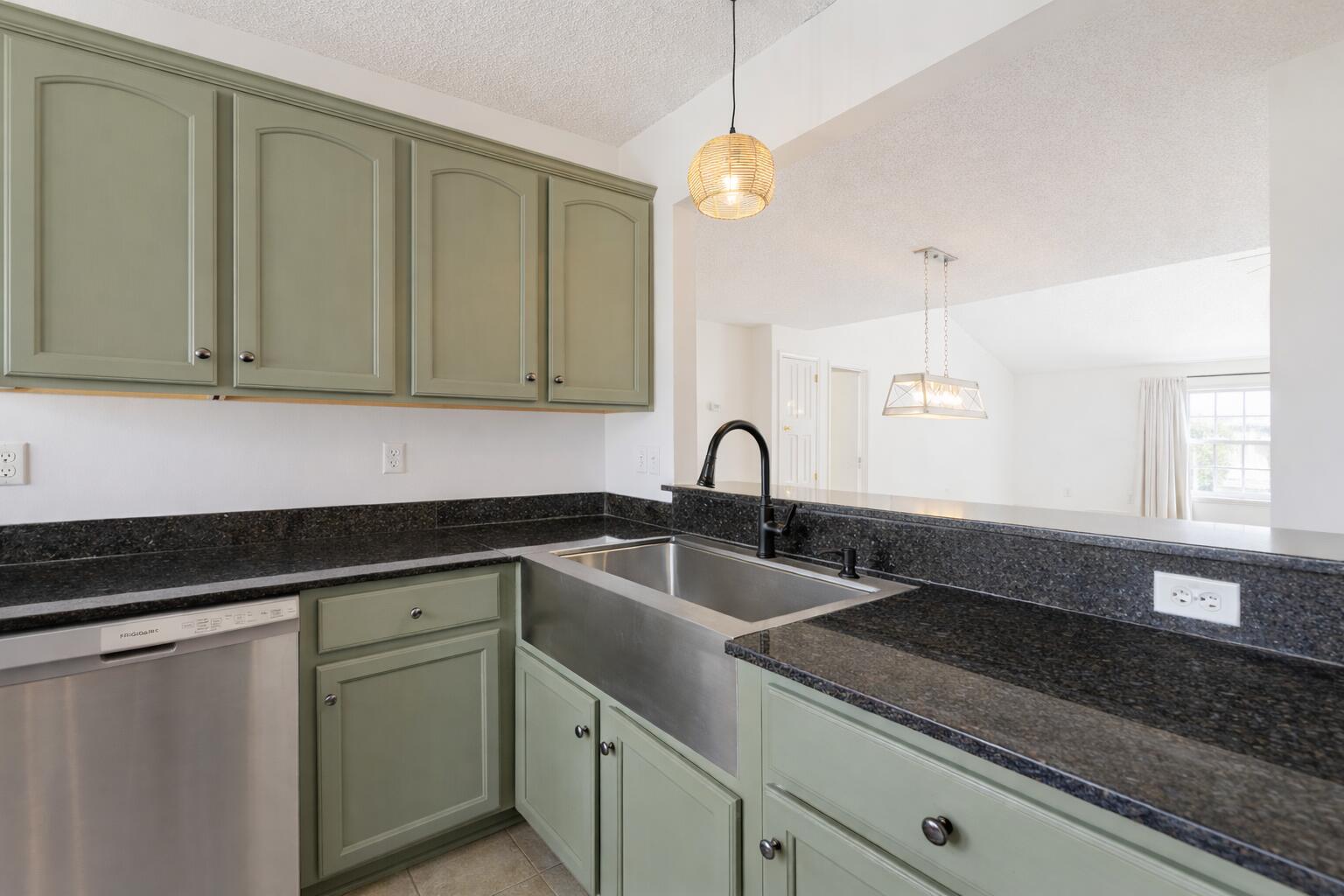 2233 Lewis Street Crestview, FL 32536 - Photo 5 of 24 a kitchen with sink cabinets and window