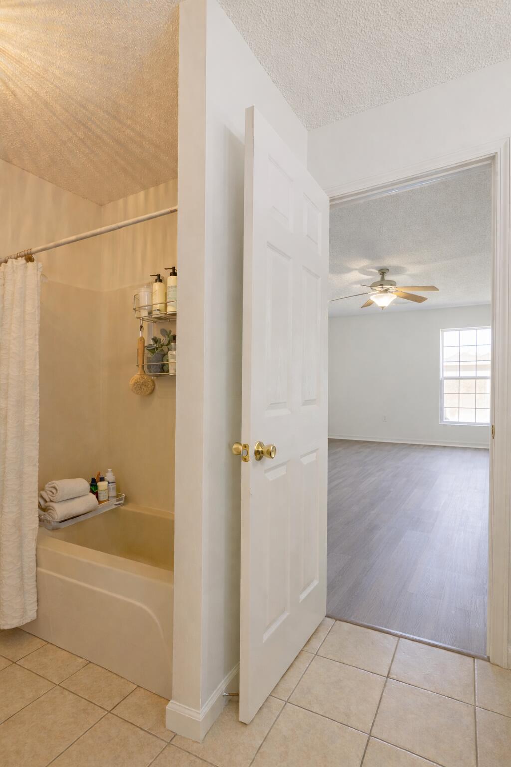 2233 Lewis Street Crestview, FL 32536 - Photo 10 of 24 a bathroom with a bathtub and shower