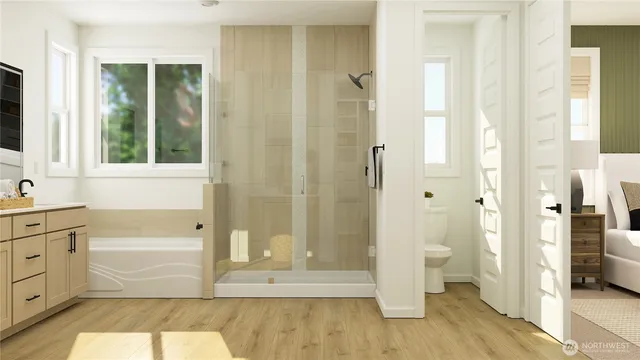 a bathroom with a tub shower and sink