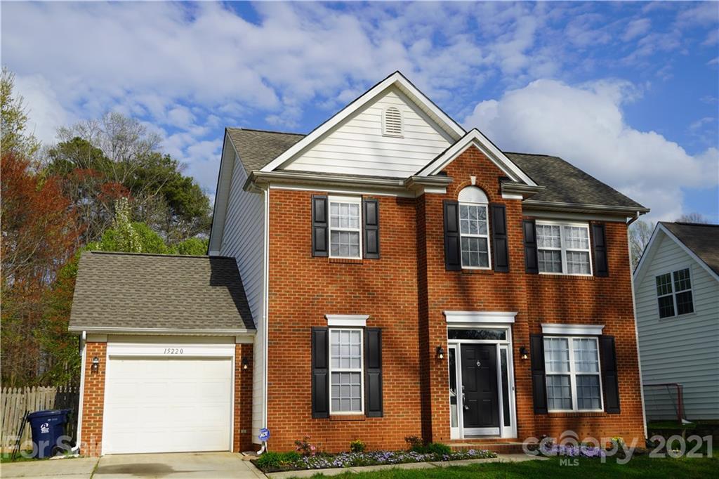 15220 Leslie Brooke Road Huntersville, NC 28078 - Photo 2 of 20 a house view with a garden and large trees