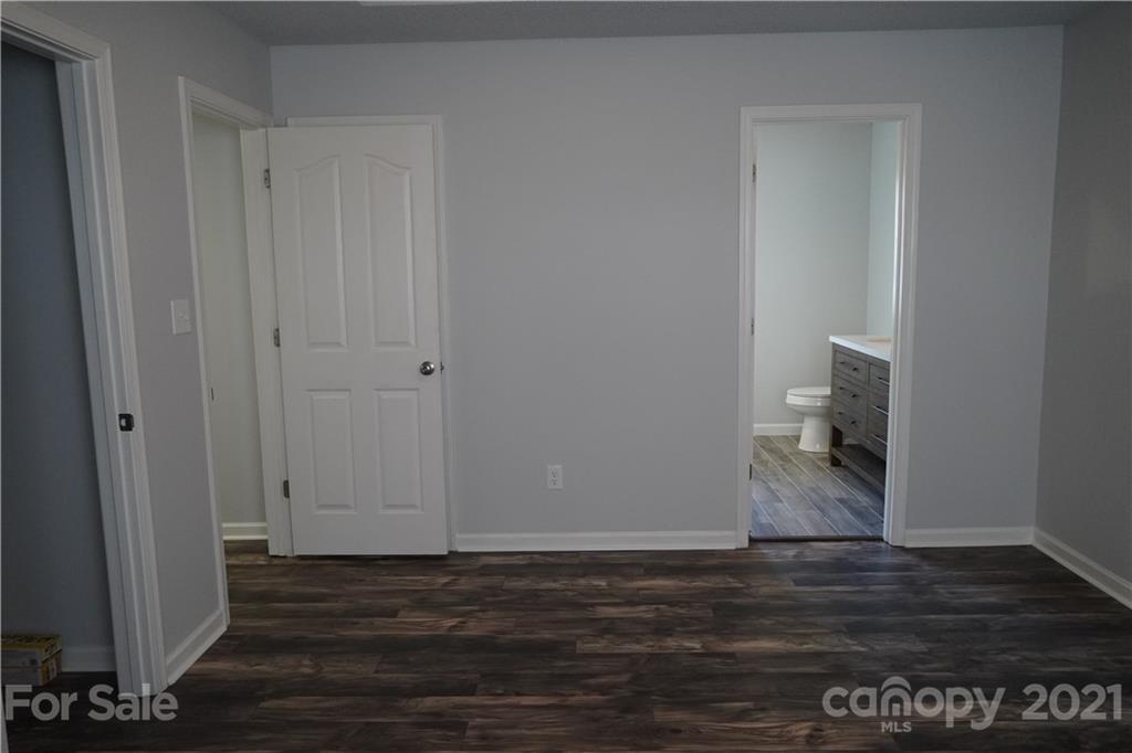 15220 Leslie Brooke Road Huntersville, NC 28078 - Photo 14 of 20 a view of empty room with wooden floor