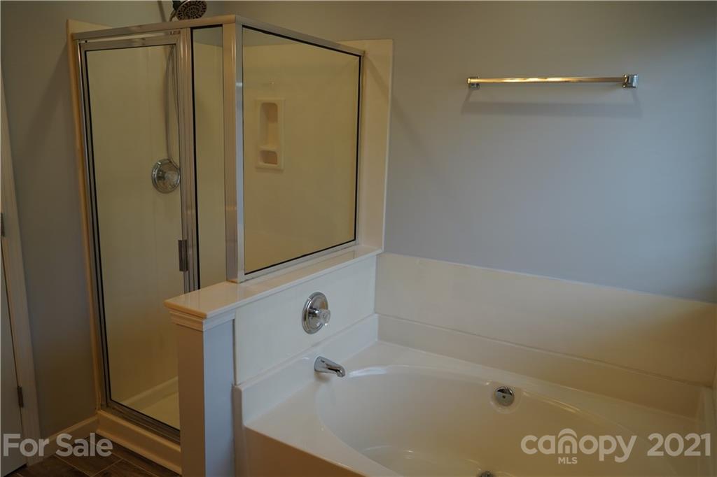 15220 Leslie Brooke Road Huntersville, NC 28078 - Photo 16 of 20 a bathroom with a bathtub
