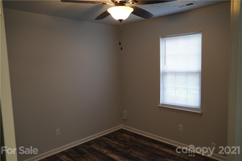 15220 Leslie Brooke Road Huntersville, NC 28078 - Photo 18 of 20 a room with a window and chandelier