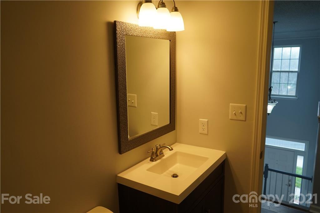 15220 Leslie Brooke Road Huntersville, NC 28078 - Photo 19 of 20 a bathroom with a sink and a mirror