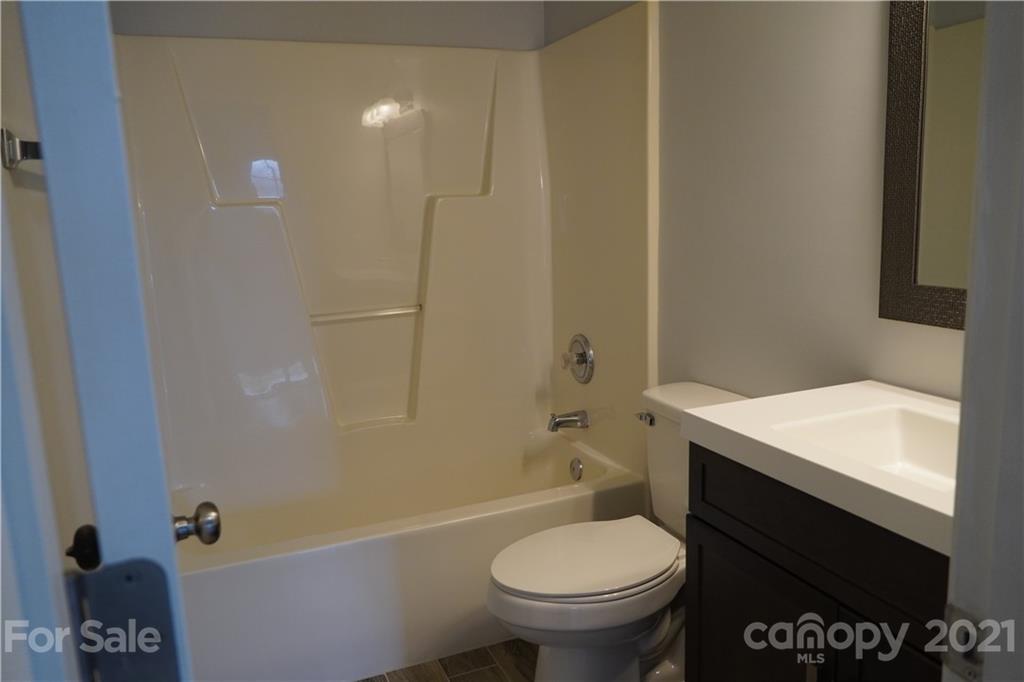 15220 Leslie Brooke Road Huntersville, NC 28078 - Photo 20 of 20 a bathroom with a sink toilet and shower