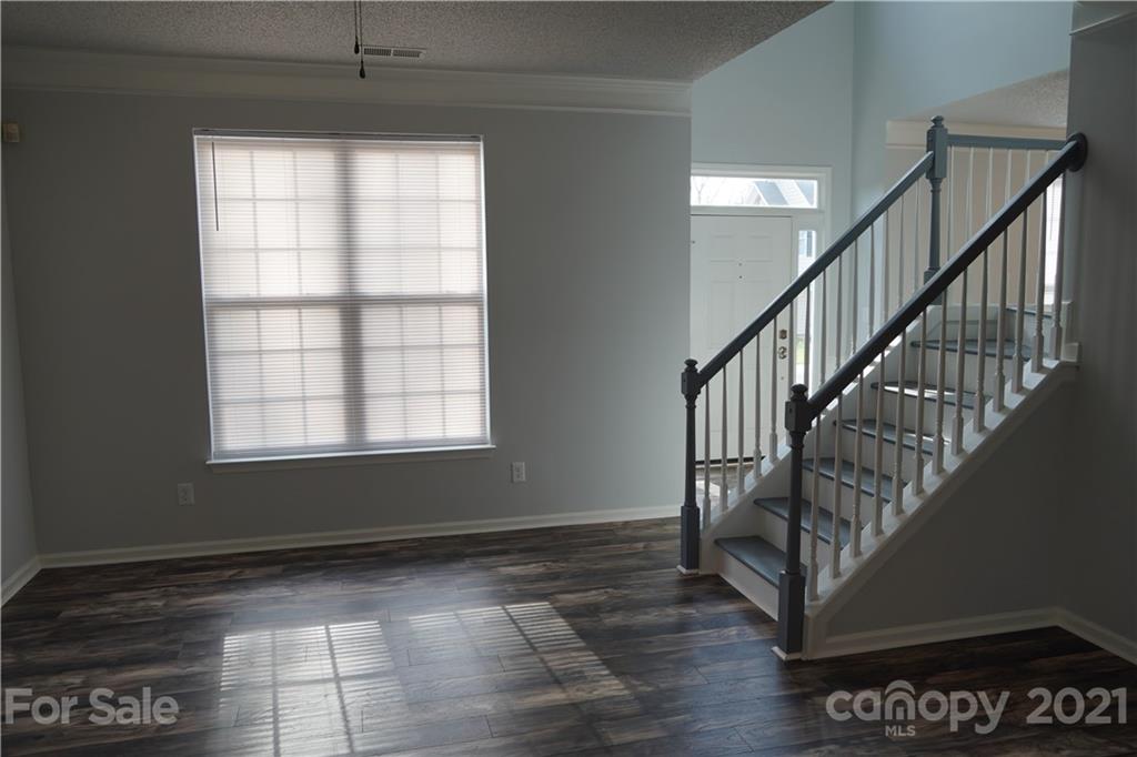 15220 Leslie Brooke Road Huntersville, NC 28078 - Photo 7 of 20 a view of entryway and hall with wooden floor